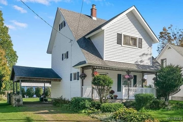 41 N Franklin St, New Albion, NY 14719 - back of house with a porch, a chimney, a lawn, and roof with shingles