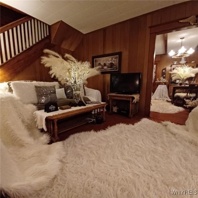 41 N Franklin St, New Albion, NY 14719 - bedroom featuring a chandelier, wood walls, and wood finished floors