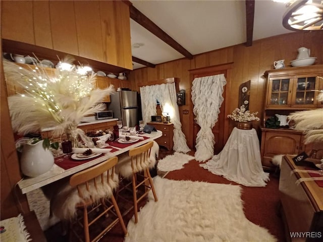 41 N Franklin St, New Albion, NY 14719 - dining area featuring beamed ceiling, wooden walls, and light carpet