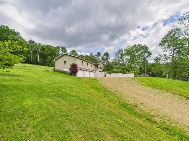 1029 Barden Brk, Ceres, PA 16731 - view of green lawn featuring an attached garage and driveway