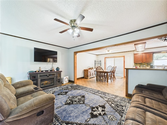 1029 Barden Brk, Ceres, PA 16731 - living room with a ceiling fan, a textured ceiling, and a lit fireplace
