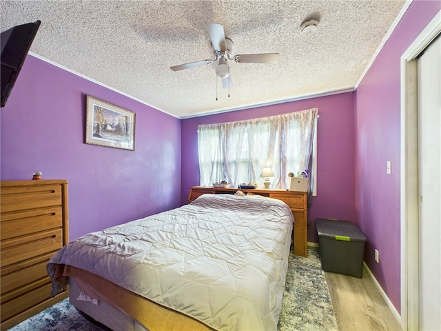 1029 Barden Brk, Ceres, PA 16731 - bedroom featuring a textured ceiling, wood finished floors, ornamental molding, and a ceiling fan