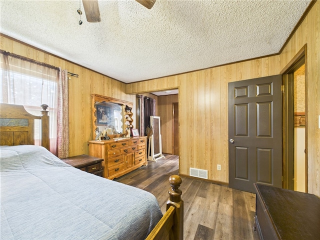 1029 Barden Brk, Ceres, PA 16731 - bedroom featuring wood walls, dark wood-style floors, a textured ceiling, and ceiling fan