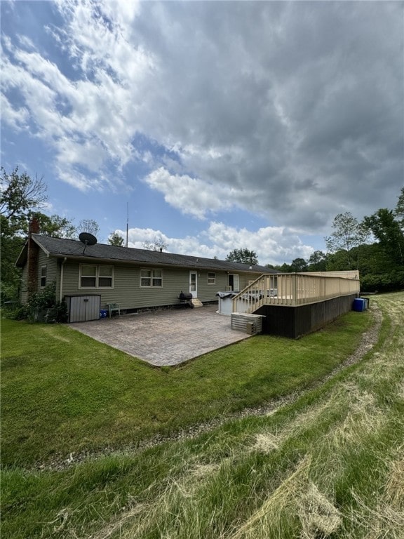 1029 Barden Brk, Ceres, PA 16731 - back of house with a patio, a wooden deck, a yard, and a chimney