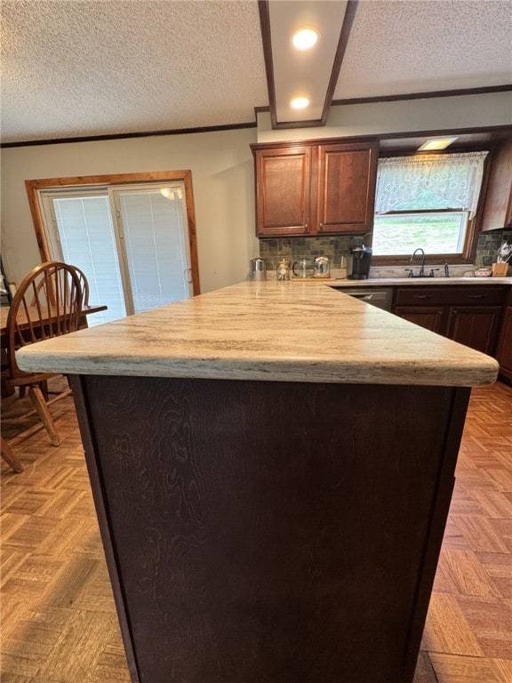1029 Barden Brk, Ceres, PA 16731 - kitchen with a peninsula, light countertops, a textured ceiling, decorative backsplash, and recessed lighting