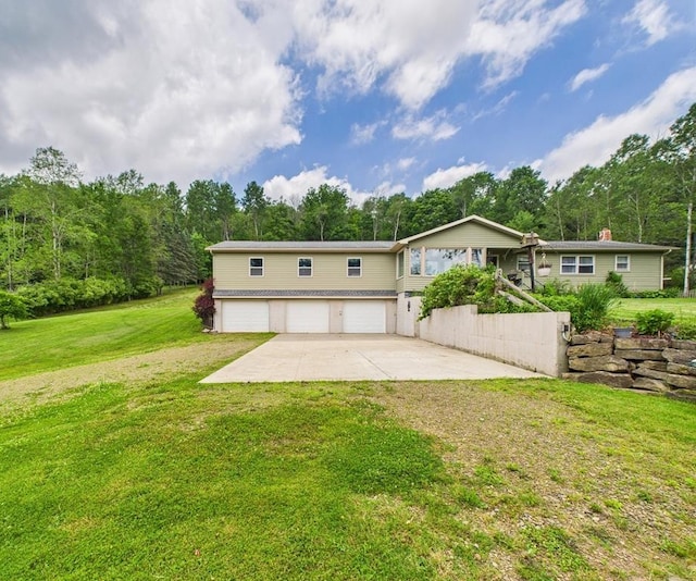1029 Barden Brk, Ceres, PA 16731 - rear view of house with a garage, concrete driveway, and a lawn