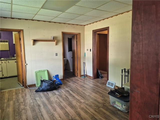 313 W 3rd St S, Fulton, NY 13069 - spare room with a drop ceiling, wood finished floors, and wood walls