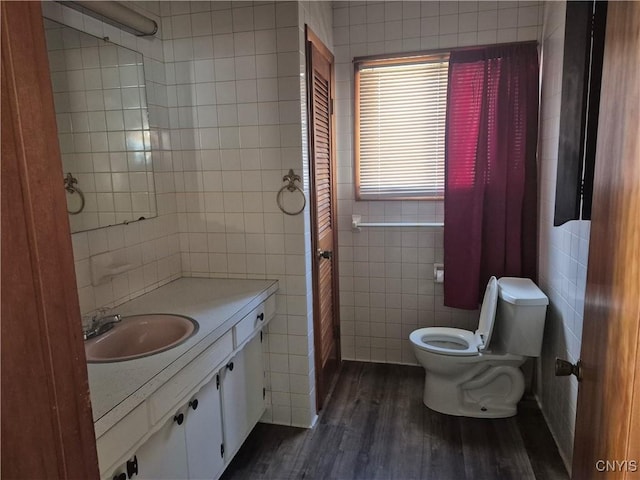 313 W 3rd St S, Fulton, NY 13069 - bathroom featuring tile walls, wood finished floors, and vanity