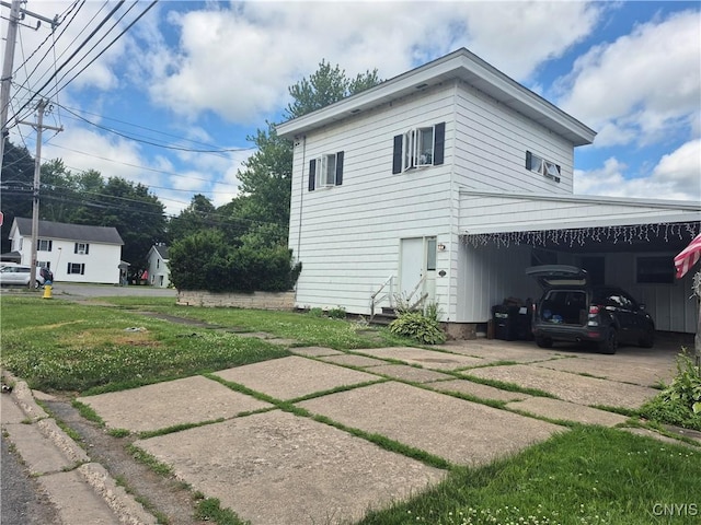 313 W 3rd St S, Fulton, NY 13069 - view of home's exterior with entry steps, concrete driveway, and a lawn