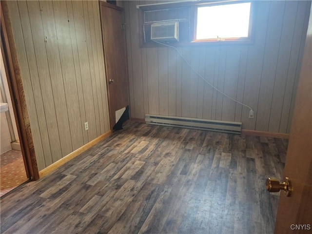 313 W 3rd St S, Fulton, NY 13069 - basement with a baseboard heating unit, wood finished floors, wooden walls, and a wall unit AC