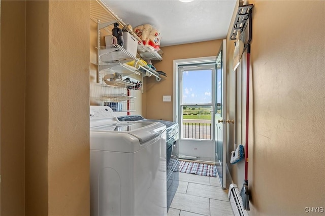 13489 Case Rd, Lyme, NY 13622 - laundry room with independent washer and dryer, light tile patterned floors, and a baseboard radiator