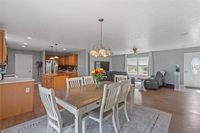 13489 Case Rd, Lyme, NY 13622 - dining area featuring light wood finished floors, a chandelier, a ceiling fan, and recessed lighting