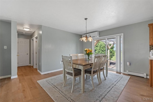 13489 Case Rd, Lyme, NY 13622 - dining space with a baseboard radiator, a wall mounted AC, light wood finished floors, and a chandelier