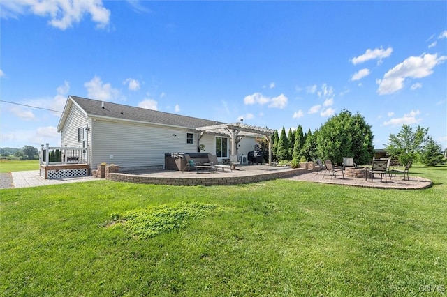 13489 Case Rd, Lyme, NY 13622 - rear view of house with a patio, a pergola, an outdoor fire pit, a lawn, and a wooden deck