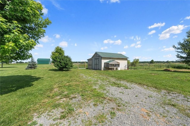 13489 Case Rd, Lyme, NY 13622 - view of yard featuring an outdoor structure and an outbuilding