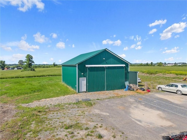 13489 Case Rd, Lyme, NY 13622 - view of pole building featuring a view of countryside and a yard