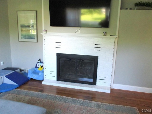 7739 Roberts St, Lenox, NY 13032 - detailed view of wood finished floors and a fireplace