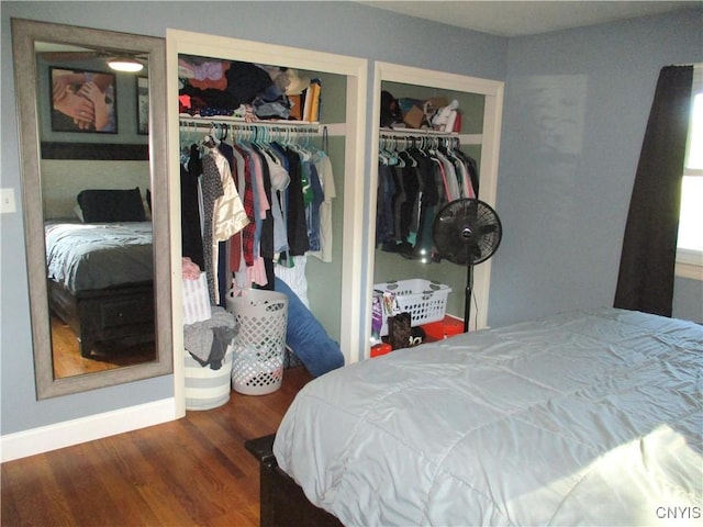 7739 Roberts St, Lenox, NY 13032 - bedroom with multiple closets and wood finished floors