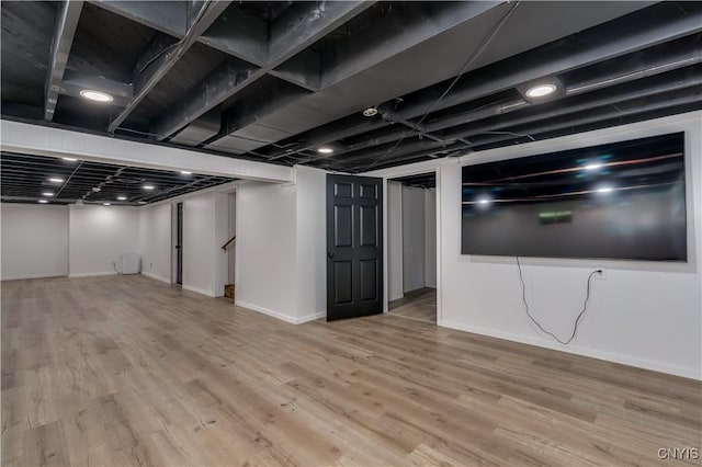 266 Chestnut St, Watertown City, NY 13601 - finished below grade area with wood finished floors and stairway