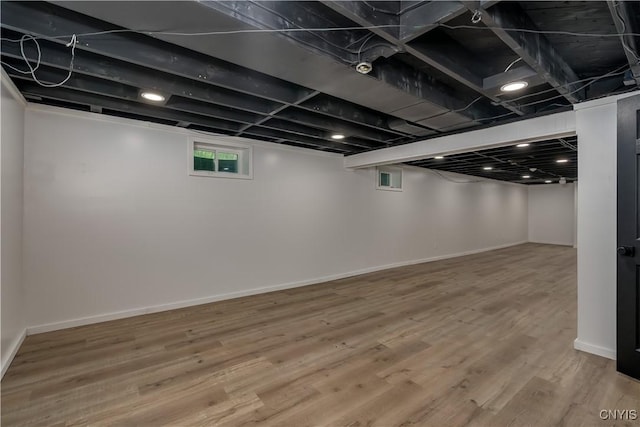 266 Chestnut St, Watertown City, NY 13601 - below grade area featuring wood finished floors and baseboards