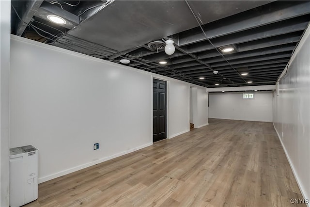266 Chestnut St, Watertown City, NY 13601 - below grade area featuring wood finished floors and baseboards