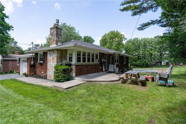 266 Chestnut St, Watertown City, NY 13601 - rear view of property with a yard, a chimney, brick siding, and stone siding