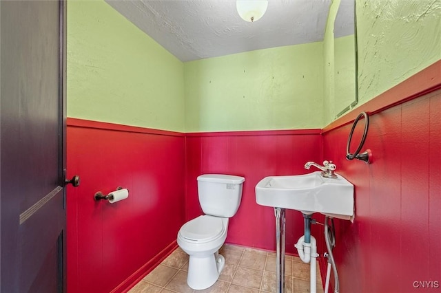 116 W Manlius St, Dewitt, NY 13057 - bathroom with toilet and tile patterned flooring