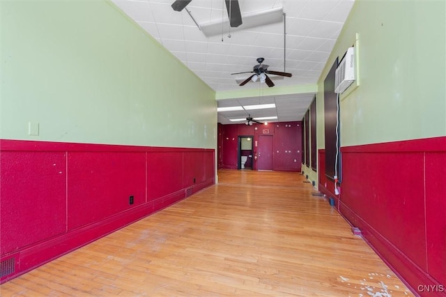 116 W Manlius St, Dewitt, NY 13057 - hallway featuring a wainscoted wall, wood finished floors, and an AC wall unit