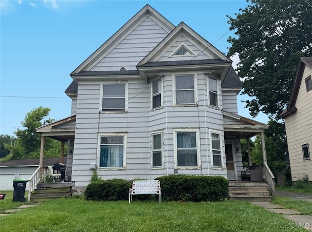 176-178 E Clark St, German Flatts, NY 13357 - victorian-style house with covered porch and a front lawn