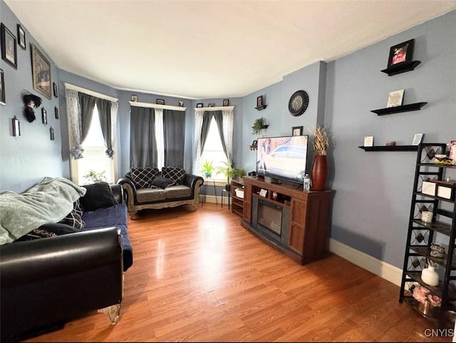 176-178 E Clark St, German Flatts, NY 13357 - living area featuring healthy amount of natural light and wood finished floors