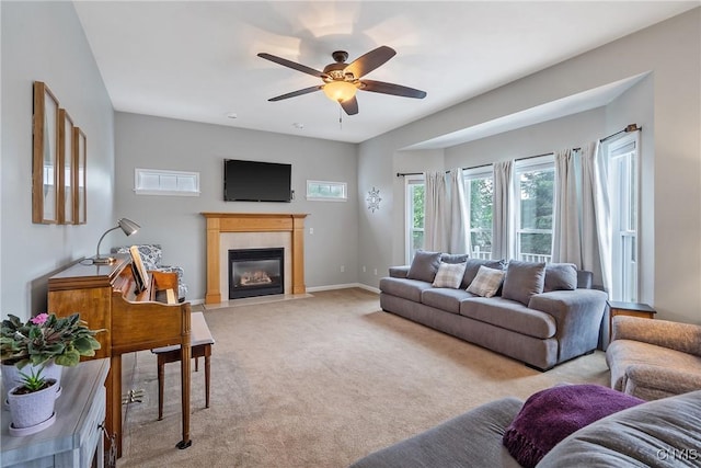 8879 Kilkenny Dr, Lysander, NY 13027 - living room featuring ceiling fan, light carpet, and a fireplace with flush hearth