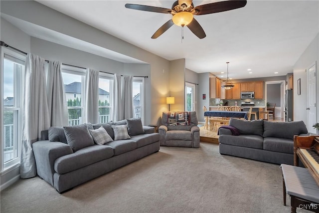 8879 Kilkenny Dr, Lysander, NY 13027 - living room with light colored carpet and ceiling fan