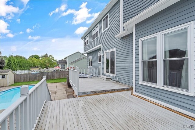 8879 Kilkenny Dr, Lysander, NY 13027 - wooden terrace with a shed and a fenced backyard