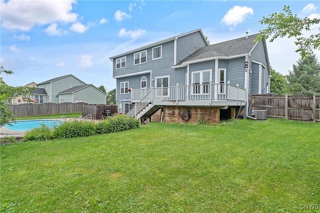 8879 Kilkenny Dr, Lysander, NY 13027 - rear view of property with a deck, a fenced backyard, and stairs