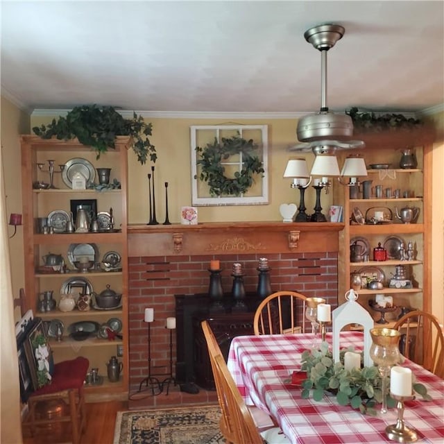 56 Briarcliff, Horseheads, NY 14845 - dining area with ornamental molding, wood finished floors, and a brick fireplace