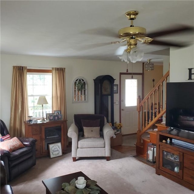 56 Briarcliff, Horseheads, NY 14845 - living room with healthy amount of natural light, a ceiling fan, and stairway