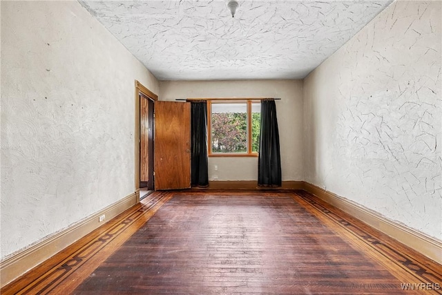 157 Laurel St, Buffalo, NY 14208 - empty room with hardwood / wood-style floors, a textured wall, and a textured ceiling