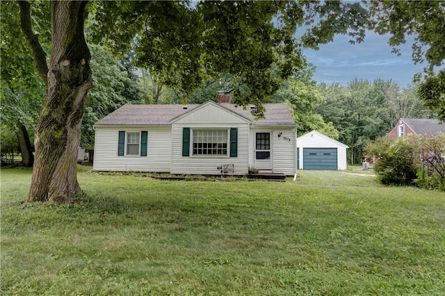 5978 State Route 21st Hwy, Williamson, NY 14589 - view of front facade with a garage, an outdoor structure, a chimney, and a front yard