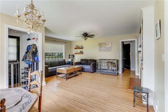 5978 State Route 21st Hwy, Williamson, NY 14589 - living room featuring light wood-style flooring, a chandelier, and a ceiling fan