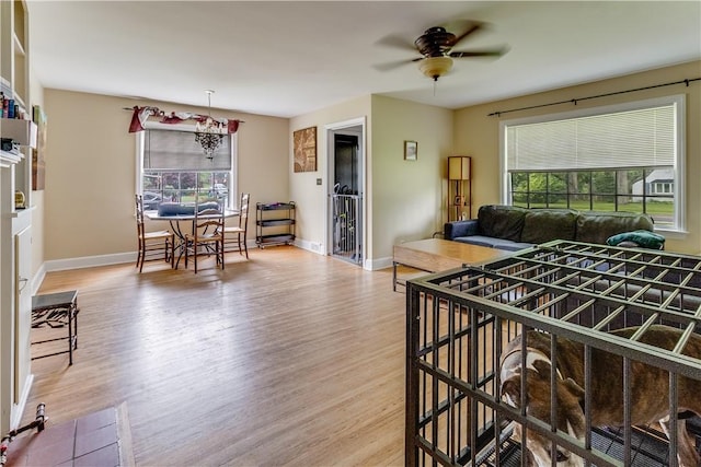5978 State Route 21st Hwy, Williamson, NY 14589 - living area featuring healthy amount of natural light, wood finished floors, and a ceiling fan