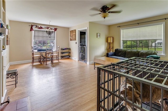 5978 State Route 21st Hwy, Williamson, NY 14589 - living room with wood finished floors and ceiling fan