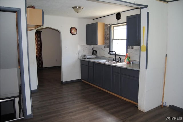 3028 Welch Ave, Niagara Falls, NY 14303 - kitchen featuring dark wood-type flooring, light countertops, and decorative backsplash