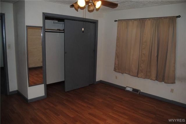 3028 Welch Ave, Niagara Falls, NY 14303 - unfurnished bedroom with dark wood-style floors, a closet, a ceiling fan, and a textured ceiling