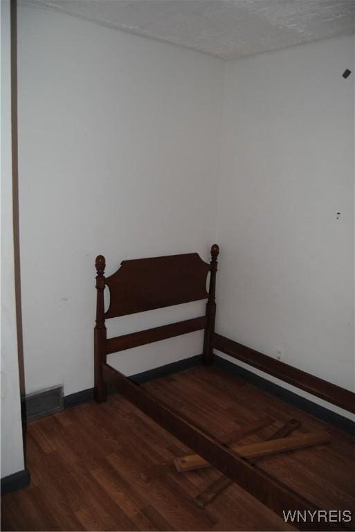 3028 Welch Ave, Niagara Falls, NY 14303 - bedroom featuring wood finished floors and baseboards