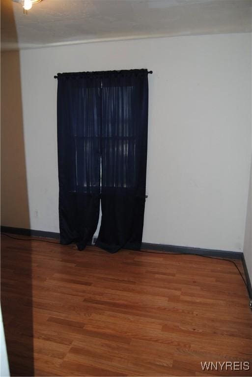 3028 Welch Ave, Niagara Falls, NY 14303 - spare room with wood finished floors and baseboards