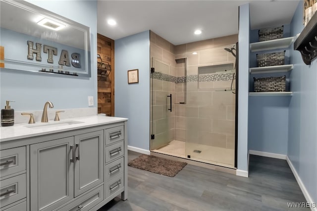 2035 Centerline Rd, Sheldon, NY 14167 - bathroom with a shower stall, vanity, wood finished floors, and recessed lighting