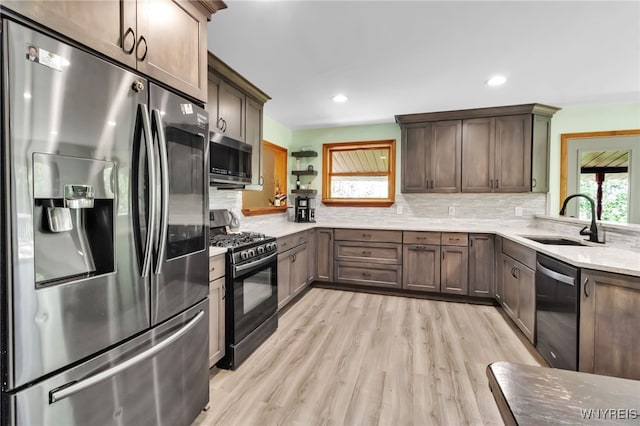 2035 Centerline Rd, Sheldon, NY 14167 - kitchen with appliances with stainless steel finishes, light wood-type flooring, backsplash, recessed lighting, and dark brown cabinetry