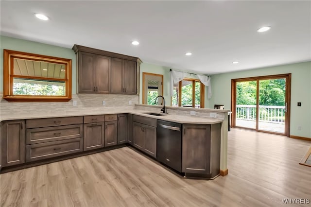 2035 Centerline Rd, Sheldon, NY 14167 - kitchen featuring stainless steel dishwasher, a peninsula, light wood-style flooring, decorative backsplash, and recessed lighting