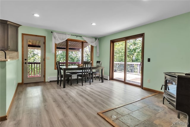 2035 Centerline Rd, Sheldon, NY 14167 - dining space featuring recessed lighting, a wood stove, and light wood-style floors