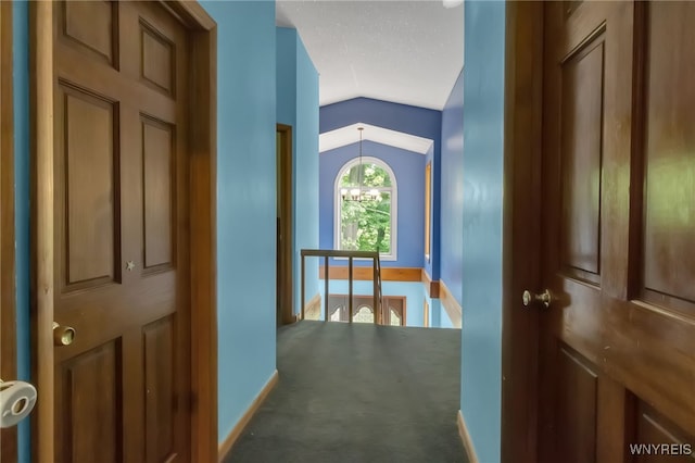 2035 Centerline Rd, Sheldon, NY 14167 - hallway with an upstairs landing, vaulted ceiling, carpet, and a chandelier